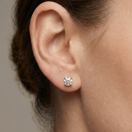 Amorati 1ctw Bold Power Studs lab grown and hand selected with E-F colorless VS+ clarity featuring oversized 14K Gold baskets for stability - Double the gold weight of standard retail studs pictured on the models left ear.