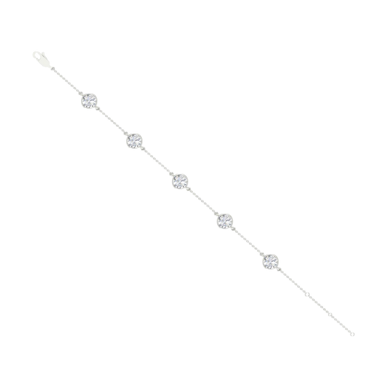 A full top-down view of a 14K white gold bracelet, showing the spaced-out, bezel-set diamonds on the delicate chain.