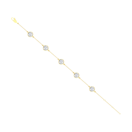 A full top-down view of a 14K yellow gold bracelet, showing the spaced-out, bezel-set diamonds on the delicate chain.