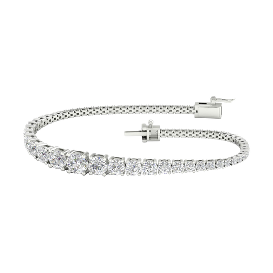 A full top-down view of a 14K white gold tennis bracelet, coiled to show the cascading line of round diamonds and the clasp.