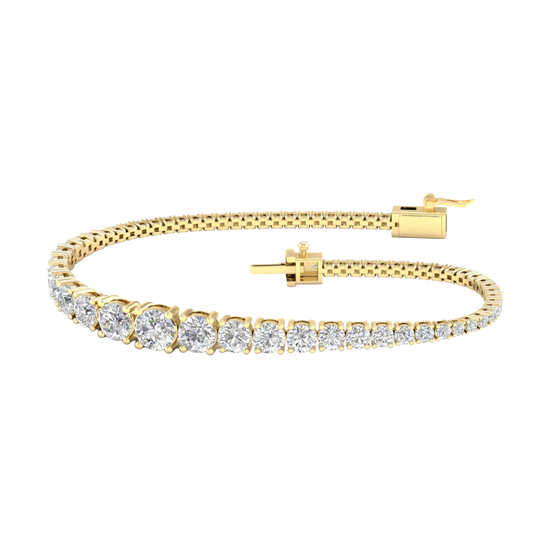 A full top-down view of a 14K yellow gold tennis bracelet, coiled to show the cascading line of round diamonds and the clasp.