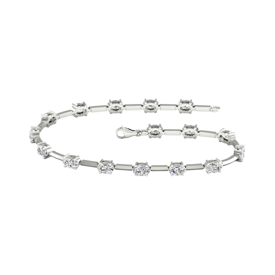 A full top-down view of a 14K white gold tennis bracelet, coiled to show the continuous line of square-cut diamonds.