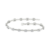 A full top-down view of a 14K white gold tennis bracelet, coiled to show the continuous line of square-cut diamonds.