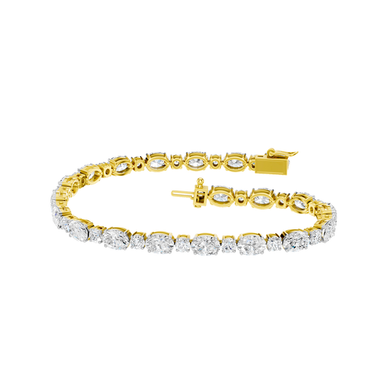 Front view of an oval-cut diamond tennis bracelet in yellow gold, featuring a continuous row of brilliant oval diamonds in a refined gold setting.