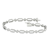 A full top-down view of a 14K white gold geometric bracelet, coiled to show the repeating pattern of interlocking links.
