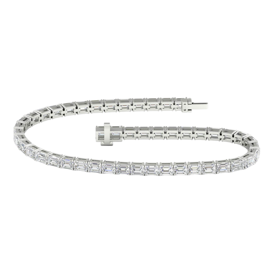 Wide view of a white gold diamond tennis bracelet featuring emerald cut white diamonds set in a continuous line, showcasing the full bracelet design.