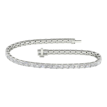 Wide view of a white gold diamond tennis bracelet featuring emerald cut white diamonds set in a continuous line, showcasing the full bracelet design.