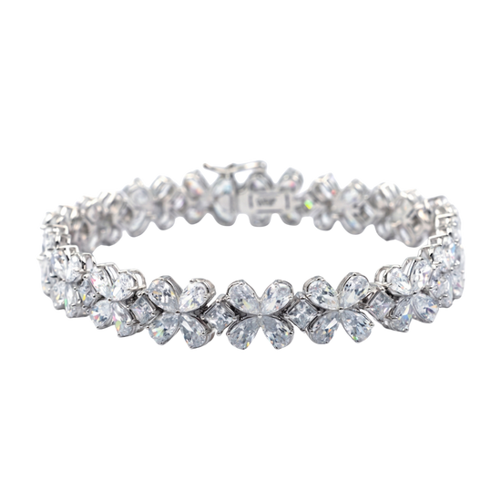 Front view of a diamond floral tennis bracelet in white gold, featuring marquise and round diamonds arranged in repeating flower-inspired clusters with a flexible, high-polish setting.