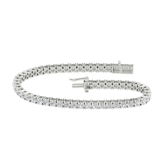A full top-down view of a 14K white gold tennis bracelet, coiled to show the seamless, continuous line of round diamonds.