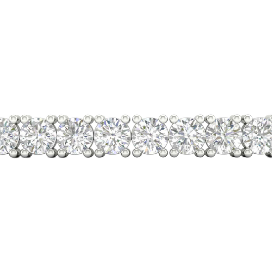 A close-up side view of a 14K white gold tennis bracelet, showing a continuous line of large, round diamonds set in a secure, four-prong setting.