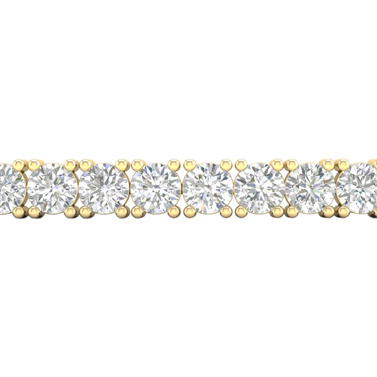 A close-up side view of a 14K yellow gold tennis bracelet, showing a continuous line of large, round diamonds set in a secure, four-prong setting.