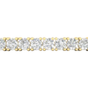 A close-up side view of a 14K yellow gold tennis bracelet, showing a continuous line of large, round diamonds set in a secure, four-prong setting.