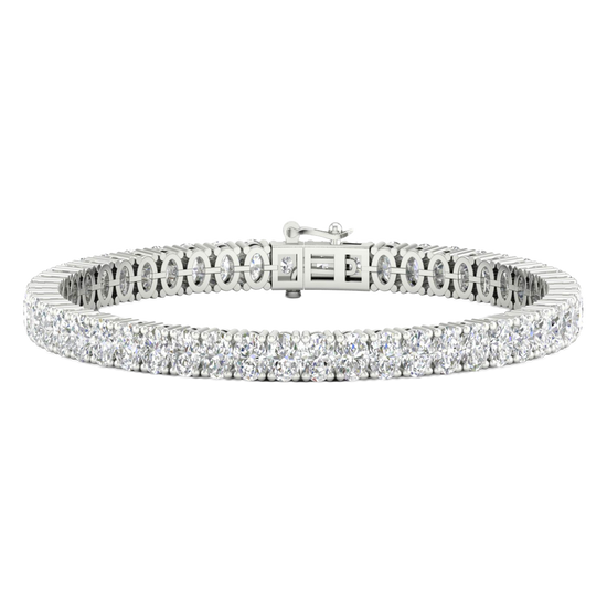 A close-up, top-down view of a lavish 14K white gold tennis bracelet featuring two continuous rows of brilliant-cut diamonds set in a four-prong or shared-prong style.