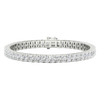 A close-up, top-down view of a lavish 14K white gold tennis bracelet featuring two continuous rows of brilliant-cut diamonds set in a four-prong or shared-prong style.