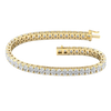 A full top-down view of a 14K yellow gold bracelet, coiled to show the bold, double-line of brilliant diamonds.