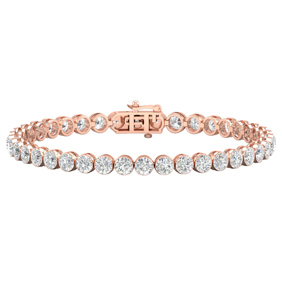 A full top-down view of a 14K rose gold tennis bracelet, coiled to show the seamless circle of brilliant diamonds.