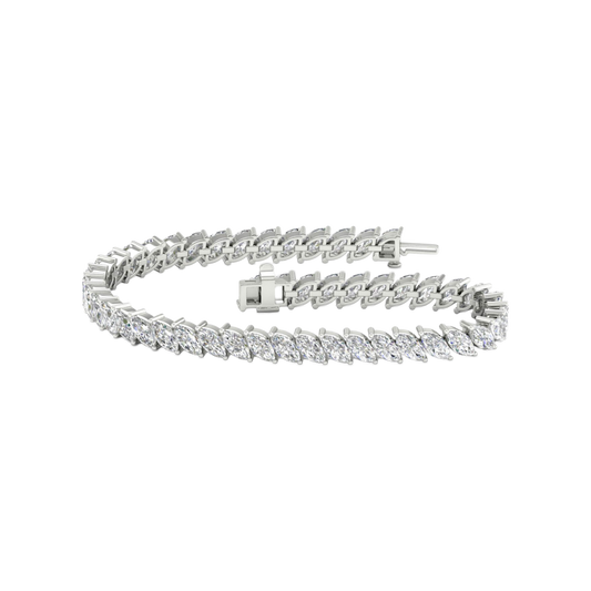 A full top-down view of a 14K white gold bracelet, coiled to show the continuous V-shaped pattern of marquise diamonds.