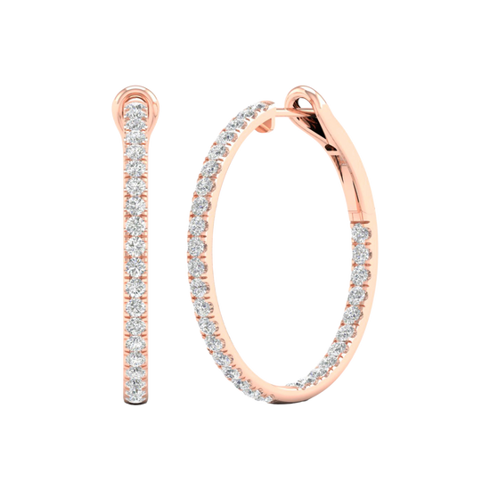 An angled view of a pair of 14K rose gold large hoop earrings, highlighting the all-around sparkle from the continuous line of diamonds.