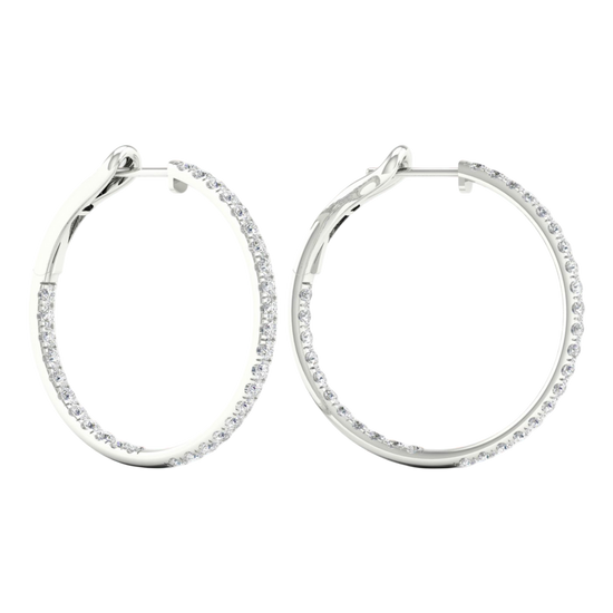 A pair of 14K white gold large hoop earrings, shown from a side angle, highlighting the line of diamonds and the hinged closure.