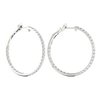 A pair of 14K white gold large hoop earrings, shown from a side angle, highlighting the line of diamonds and the hinged closure.