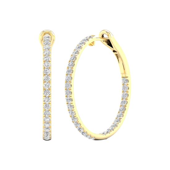 An angled view of a pair of 14K yellow gold large hoop earrings, highlighting the all-around sparkle from the continuous line of diamonds.