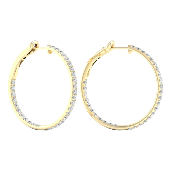 A pair of 14K yellow gold large hoop earrings, shown from a side angle, highlighting the line of diamonds and the hinged closure.