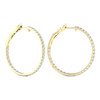 A pair of 14K yellow gold large hoop earrings, shown from a side angle, highlighting the line of diamonds and the hinged closure.