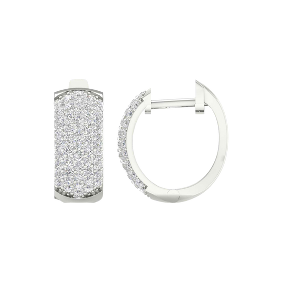 A front and side view of 14K white gold huggie hoops, featuring sparkling pavé diamonds across the front.