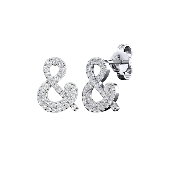 An angled view of a pair of 14K white gold stud earrings, showcasing the sparkling ampersand shape.