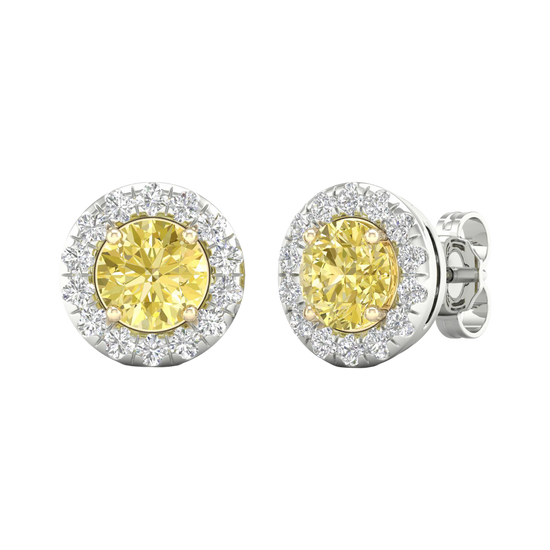 An angled view of a pair of 14K white gold stud earrings, with a with a 2 carat total weight VS+  yellow diamond at the center and a halo of white diamonds, showcasing the full design.