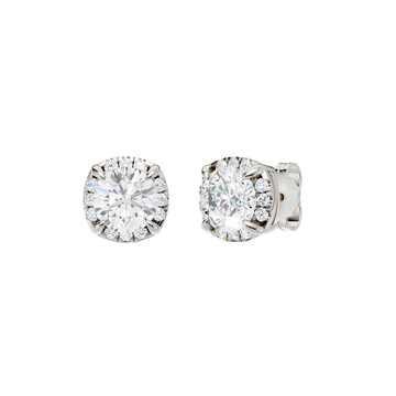 Angled view of white gold round halo diamond stud earrings highlighting center stone brilliance, halo sparkle, and polished metal finish.