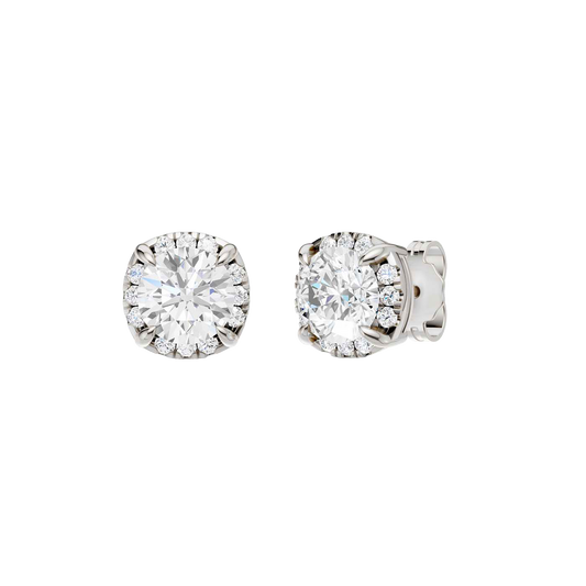 Angled view of white gold round halo diamond stud earrings highlighting center stone brilliance, halo sparkle, and polished metal finish.