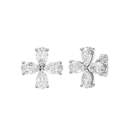 A front-facing product shot of a pair of white gold or platinum flower stud earrings.