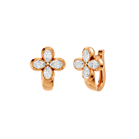 Angled view of rose gold floral diamond huggie earrings highlighting the dimensional flower motif, diamond sparkle, and polished metal finish.
