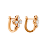 Back view of rose gold floral diamond huggie earrings displaying the smooth polished metal, hinge mechanism, and clean construction.