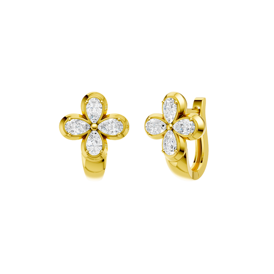 Angled view of yellow gold floral diamond huggie earrings highlighting warm gold tones, dimensional flower detailing, and diamond sparkle.
