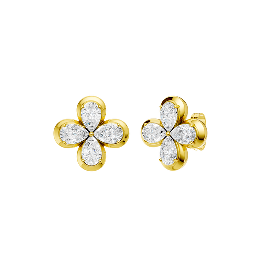 Angled view of yellow gold floral diamond stud earrings highlighting warm gold tones, dimensional flower detailing, and diamond sparkle.