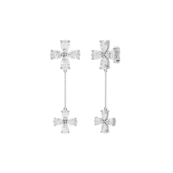 Angled view of white gold floral diamond drop earrings highlighting the dimensional flower design, articulated movement, and diamond brilliance.