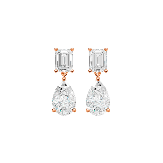 High-polish 14k rose gold drop earrings by Amorati featuring a mismatched emerald-cut and pear-cut lab-grown diamond for a modern look.