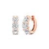 An angled view of a pair of 14K rose gold huggie hoops, highlighting the wide, double-row design.