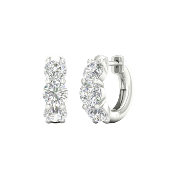 An angled view of a pair of 14K white gold huggie hoops, highlighting the wide, double-row design.