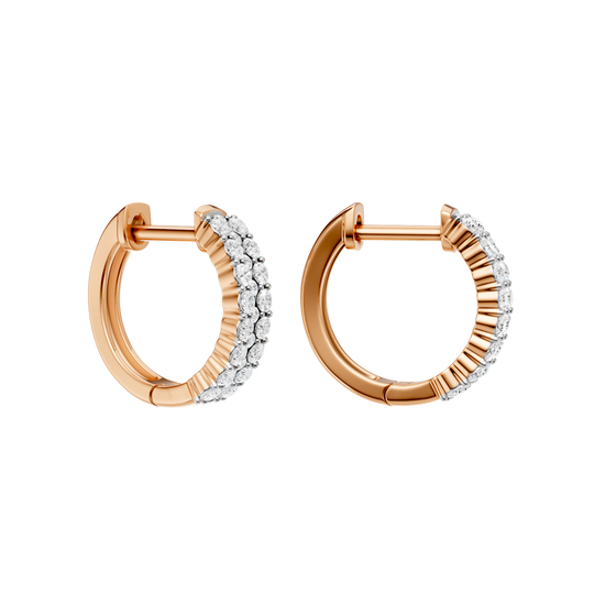 An angled view of a 14K rose gold huggie hoop highlighting its wide double-row style.