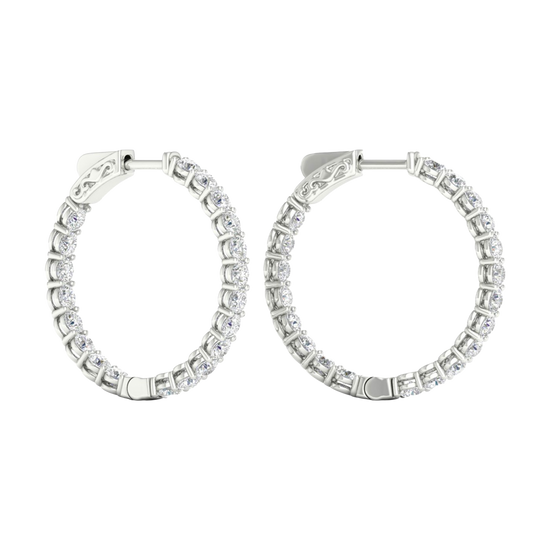A profile view of 14K white gold huggie hoop earrings, showing a continuous circle of brilliant, round-cut diamonds on the outer circumference.