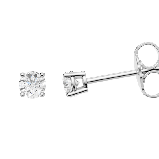 Amorati 1.0 cttw bold power studs, this side view of white gold round diamond stud earrings highlighting diamond brilliance, prong detail, and polished metal finish.