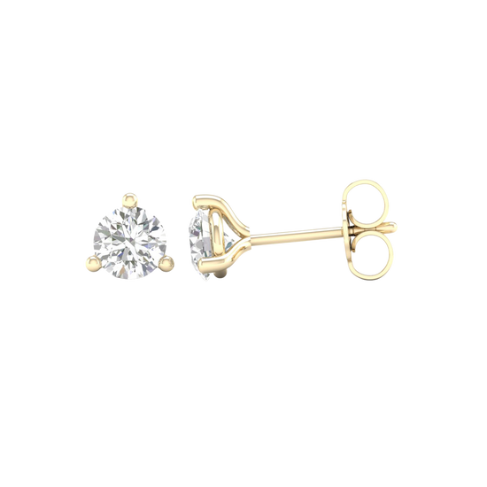 An angled view of Amorati Bold 1.0 cttw Martini-set stud earring in 10K yellow gold three-prong diamond stud earrings, showcasing the full design.