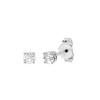 Angled view of white gold round diamond stud earrings highlighting diamond brilliance, prong detail, and polished metal finish.