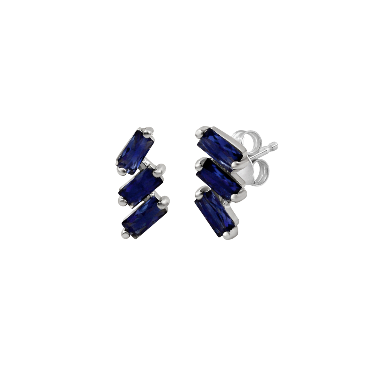 A pair of cascading stud earrings featuring a vertical arrangement of three baguette-cut blue sapphires. The rectangular gemstones are staggered in a step-like formation and held in a minimalist 18k white gold setting, shown against a clean, white studio background.