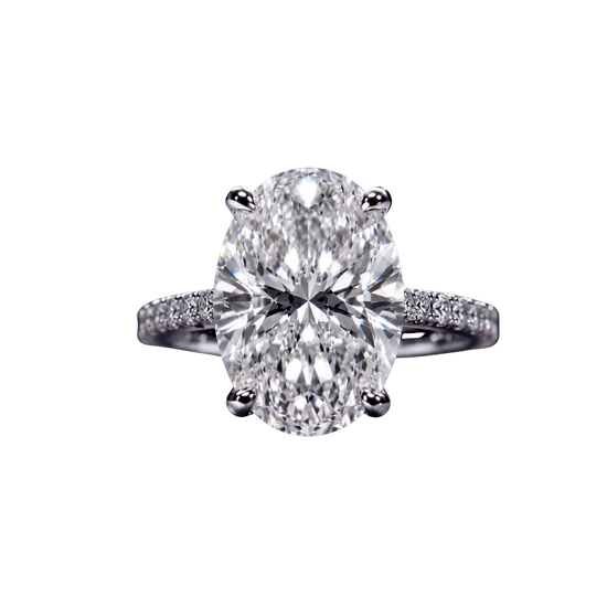 Top-down view of a classic white gold or platinum engagement ring featuring a large brilliant oval-cut center diamond on a sparkling micro-pavé diamond band.