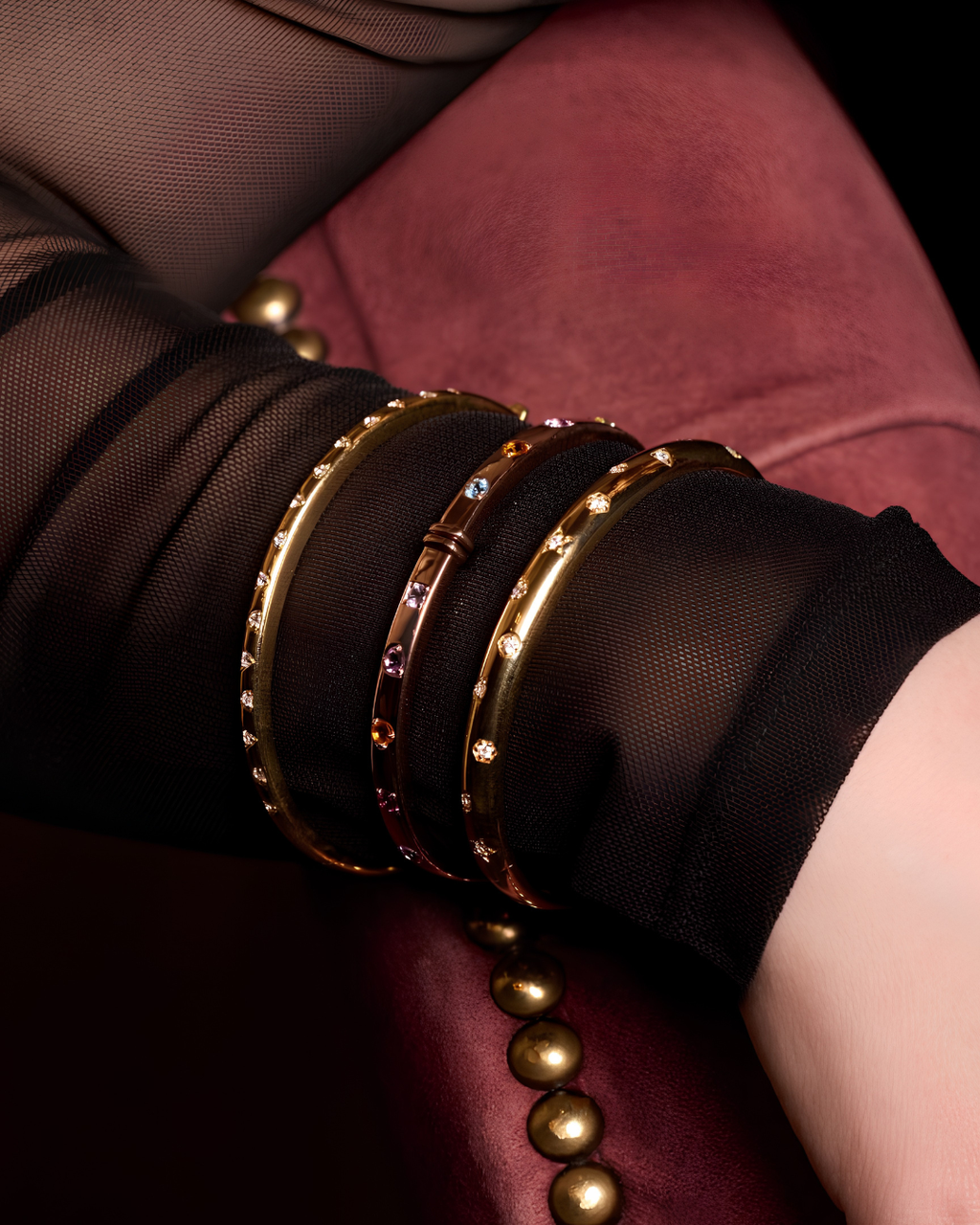 A substantial, high-polish 14k yellow gold wide cuff from the Amorati Fourteen Collection, featuring scattered star and geometric insets with shimmering round lab-grown diamonds, gracefully styled on a model’s wrist.
