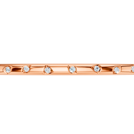 A substantial, high-polish 14k rose gold wide cuff from the Amorati Fourteen Collection, featuring scattered star and geometric insets with shimmering round lab-grown diamonds.